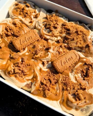Biscoff cinnamon rolls in a baking pan.