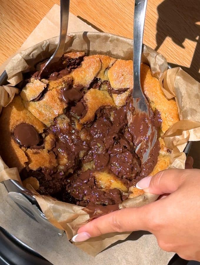 Scoopable cookies with a few bites missing.