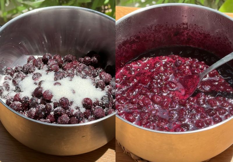 Fresh blueberries, granulated sugar, and a splash of lemon juice simmering in a small stainless steel saucepan on the stovetop. A close-up shot of a hand using a fork to smash softened blueberries in a saucepan as they cook down into a thick, glossy jam texture.