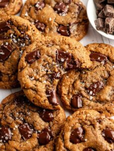 Top of coffee cookies with the top one with a bite missing.