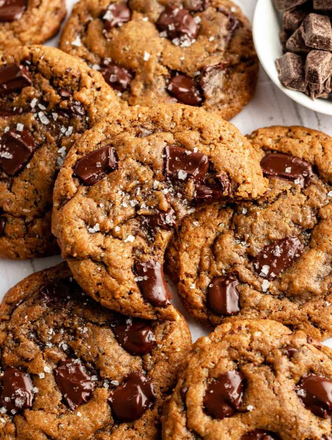 Top of coffee cookies with the top one with a bite missing.