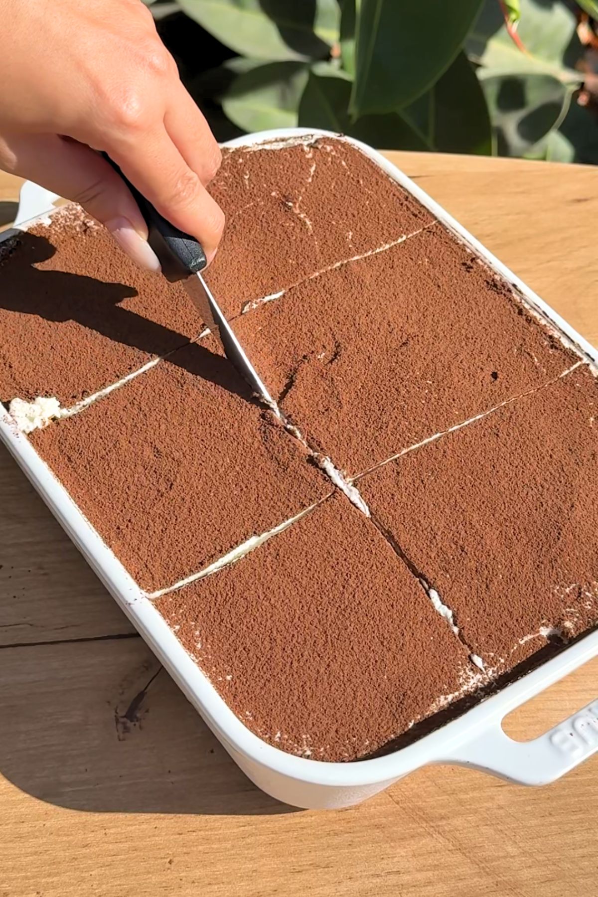 Knife slicing into a bananamisu.