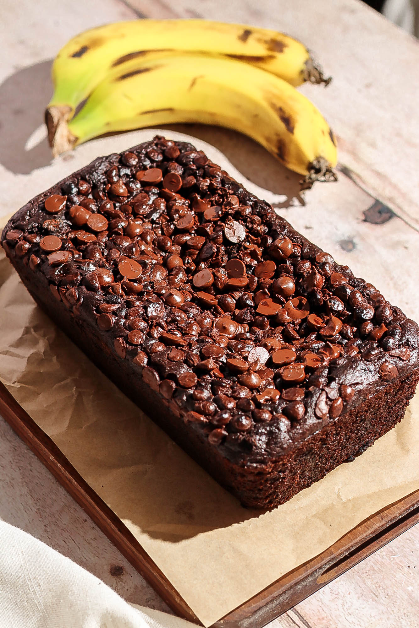 Double chocolate banana bread on a wooden board.